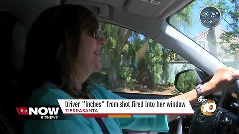 Driver "inches" from shot fired into her window