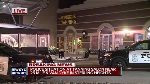 Police situation at tanning salon near 25 Mile and Van Dyke