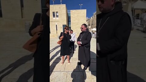 Israeli Jew tells Catholic Priest to take off the Cross!!!