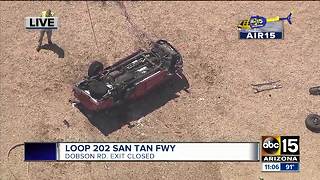 Fiery rollover shuts down freeway exit