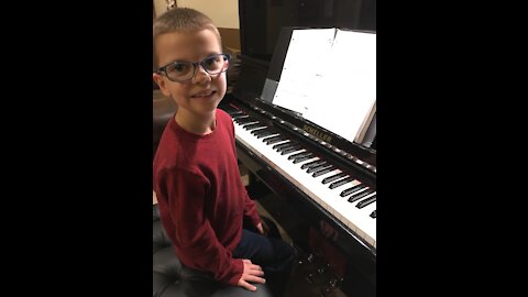 Musically gifted child plays God Rest Ye Merry Gentlemen