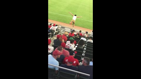 College student runs onto field during Atlanta Braves game
