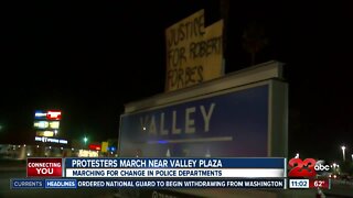 Protestors march near valley plaza for change in police departments
