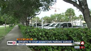 Opponents try to drive away parking garage
