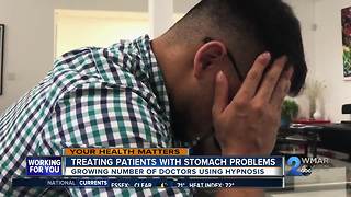 Doctors treating stomach problems with hypnosis