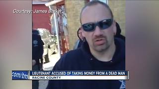 Racine officer accused of stealing money from dead man