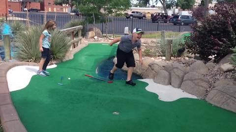Boy Falls In Water Trap At Mini Golf Course