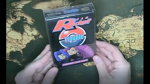 Unboxing a sealed Pokemon Team Rocket Trouble theme deck