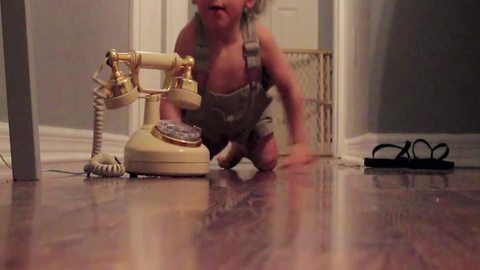 Baby Girl Receives An Important Phone Call