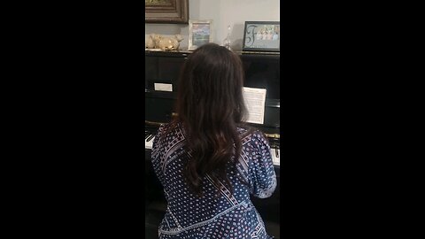 Rebekah playing the piano