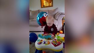 Adorable Baby Boy VS Elmo Helium Balloon
