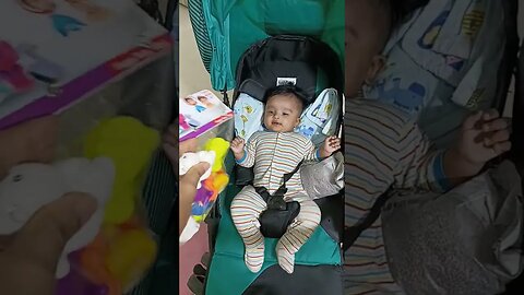 4 month old baby enjoying toys