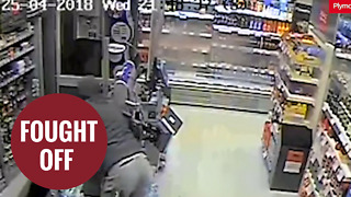 Brave female shop worker fights off armed robber