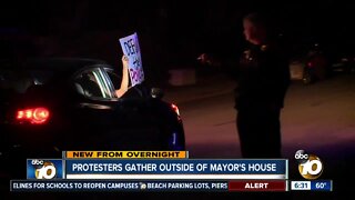 Dozens rally outside mayor's home after budget approval