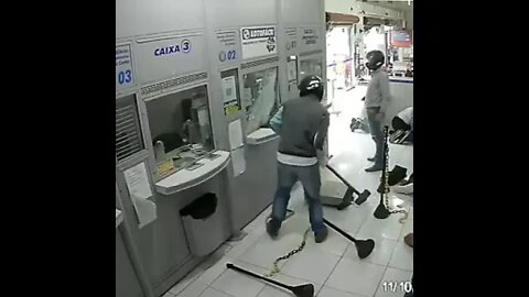 BRAZIL - Bizarre Sledgehammer Robbery Caught On Camera