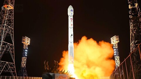 North Korean TV shows photos of satellite launch