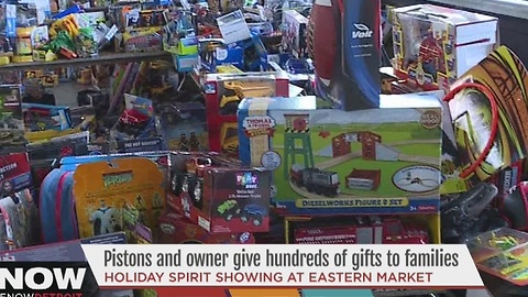 Pistons owner gives gifts to families