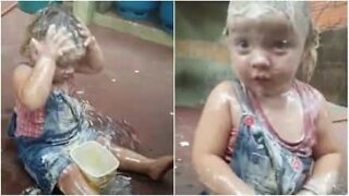 Little girl covers herself in margarine from head to toe