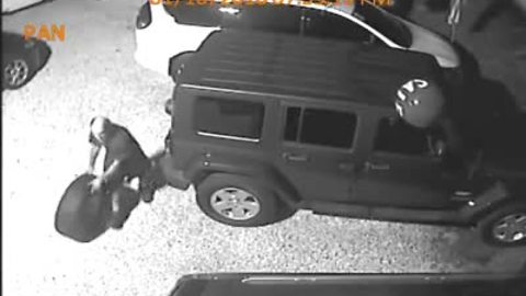 Surveillance video: Wheel stolen off back of Jeep