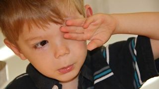 Boy gets an eye exam for the first time.