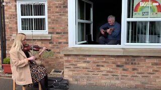 Violinist visits her grandpa in quarantine for musical reunion