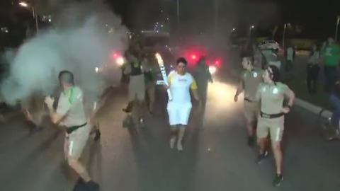 Man Tries to Put Out Olympic Flame With Fire Extinguisher