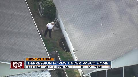Large depression threatens homes in New Port Richey