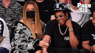 Beyonce and Jay-Z sizzle nets game