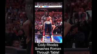 WWE Shorts. Cody Rhodes smashed Roman Reigns through announce table.