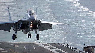 Slow Motion Footage Of Jet Fighter Landing Onto Aircraft Carrier