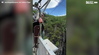 Gentle shove prompts hesitant woman to make bungee jump