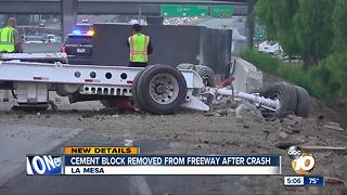 Cement block removed from freeway after crash