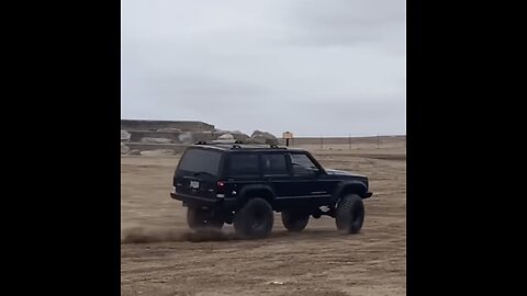 Toddler whips donuts in Jeep Cherokee XJ