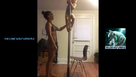 A mother lets her daughter practice pole dancing with her.