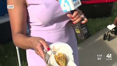 Dia Wall tries corn ribs at Kansas City Pride Fest