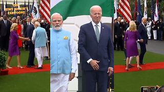 Biden won't let go of Indian prime minister's hand, slowly lowers his hand from his heart after realizing they're playing the Indian national anthem.