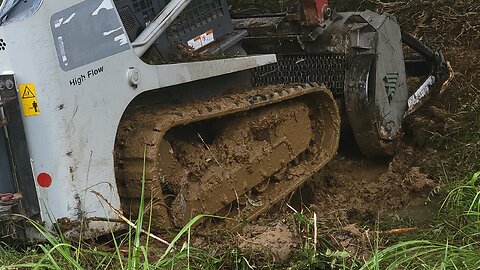 STUCK IN THE MUD: 17,000 LBS. TRACKLOADER AND FORESTRY MULCHER HEAD