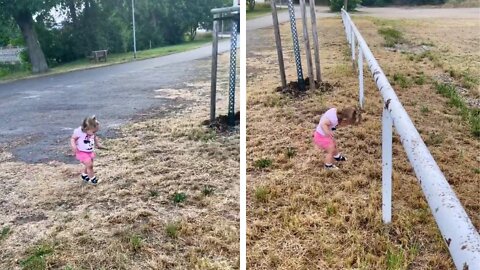 a little girl funny passes a barrier in the form of a barrier