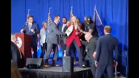 Two Women Rush the Stage at DeSantis Speech, Dragged off by Security