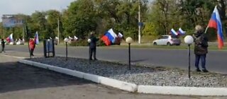 Ukrainians with Russian flags celebrate in joining Russia!