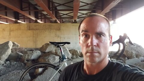 First, Livestreaming Under A Bridge On A Bicycle, Down by a River, Iowa