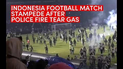 Indonesian football match stampede: At least 125 dead after fans storm pitch, police fire tear gas