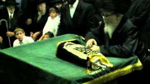 Skverrer Rebbe dancing with a Torah Scroll