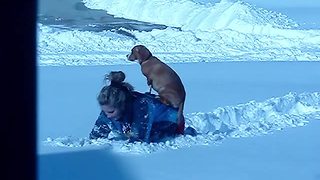 Dog Refuses To Touch Snow, So She Rides On The Back Of Her Owner