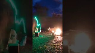 Chopping firewood next to a campfire. Night lapse