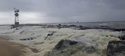 Ocean City, MD Seafoam blowing over the jetty