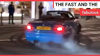 Footage shows a number of expensive cars performing 'doughnuts', leaving tyre marks and speeding