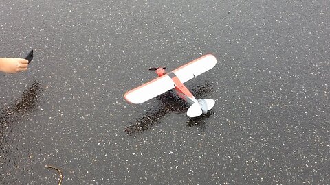 My Friend's E-flite UMX Carbon Cub SS BNF Maiden flight in Church Parking Lot in Wind and Rain