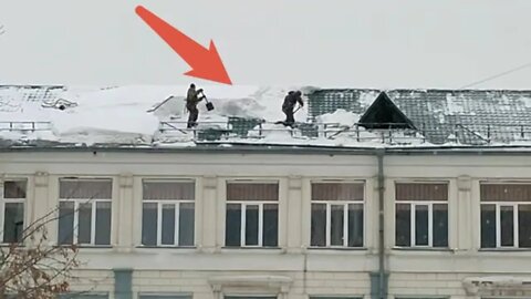 Workers were almost blown off the roof by an avalanche in Siberia