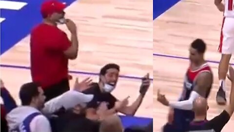 Kyle Kuzma gives the middle finger to a Pistons fan